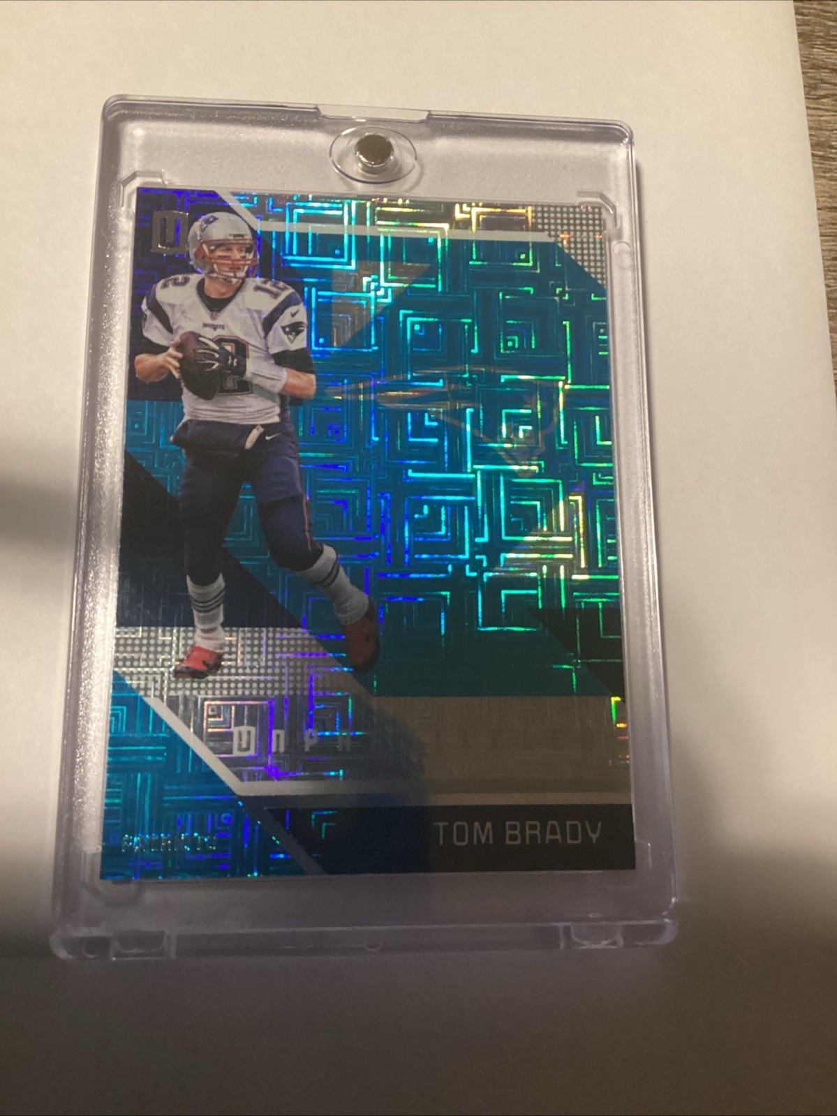 2016 Panini Unparalleled - Tom Brady #99 Teal Escher Squares Blue Mojo SP #99