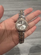 This silver and rose gold-toned womens wristw...