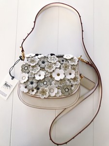 coach tea rose saddle bolsa