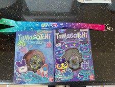 2023 SDCC Cosmic Shell Tamagotchi OG Tama GEN 1  2 NEW IN HAND W/ Lanyard