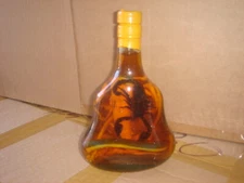 real cobra snake and a scorpion in a large X O glass bottle 7" tall