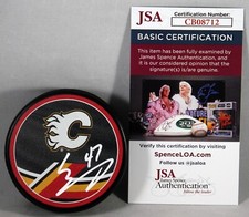 CONNOR ZARY SIGNED CALGARY FLAMES REVERSE RETRO Puck NHL AUTOGRAPHED JSA COA