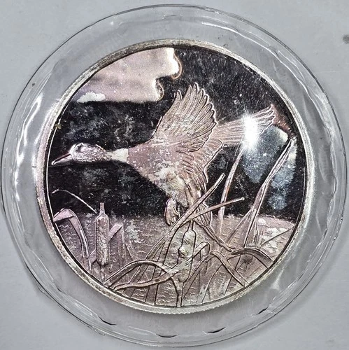 Toned Vintage 1oz .999 Silver Flying Mallard Round in Mint Packaging