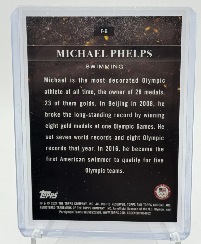 2024 Topps Cromo Olímpico Michael Phelps F/9 Llamas Bandera Refractor/76 Foto 2 de 2
