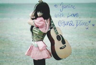 Aura Dione - Originalautogramm