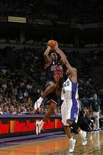 Trenton Hassell Chicago Bulls shoots over Sam Cassell Milwaukee B- 2002 Photo