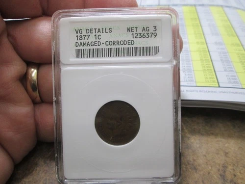 1877 US INDIAN HEAD CENT IN ANACS VERY GOOD CONDITION WITH SOME POROSITY DENTED