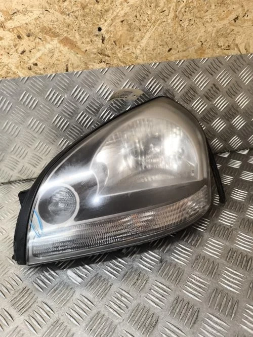 Optique avant principal gauche (feux)(phare) HYUNDAI TUCSON 1 921012E010 D4EA - Photo 1/4