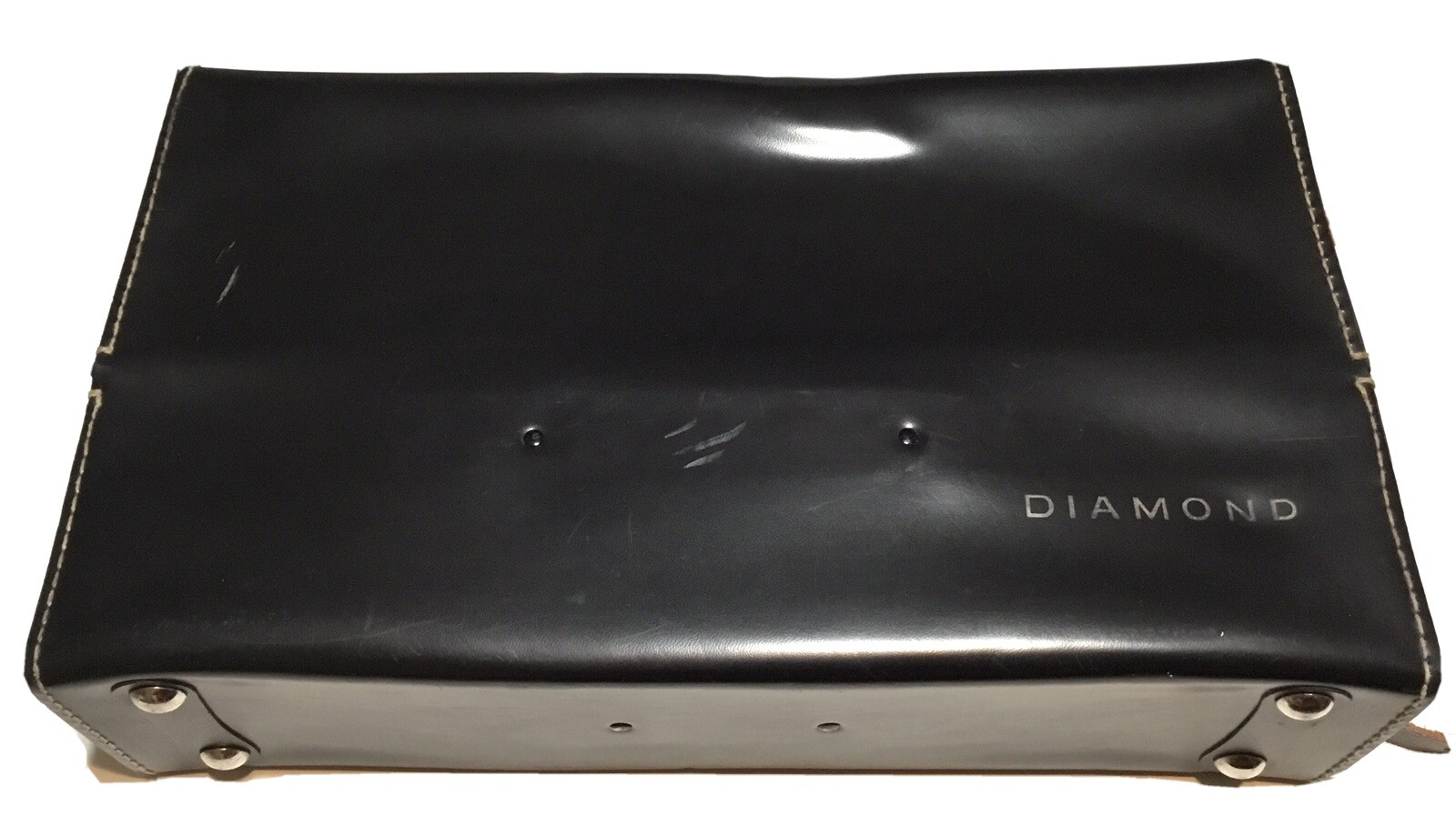 Black vintage hard camera case with textured leather sides and “Diamond” logo on top, made in USA by Diamond.