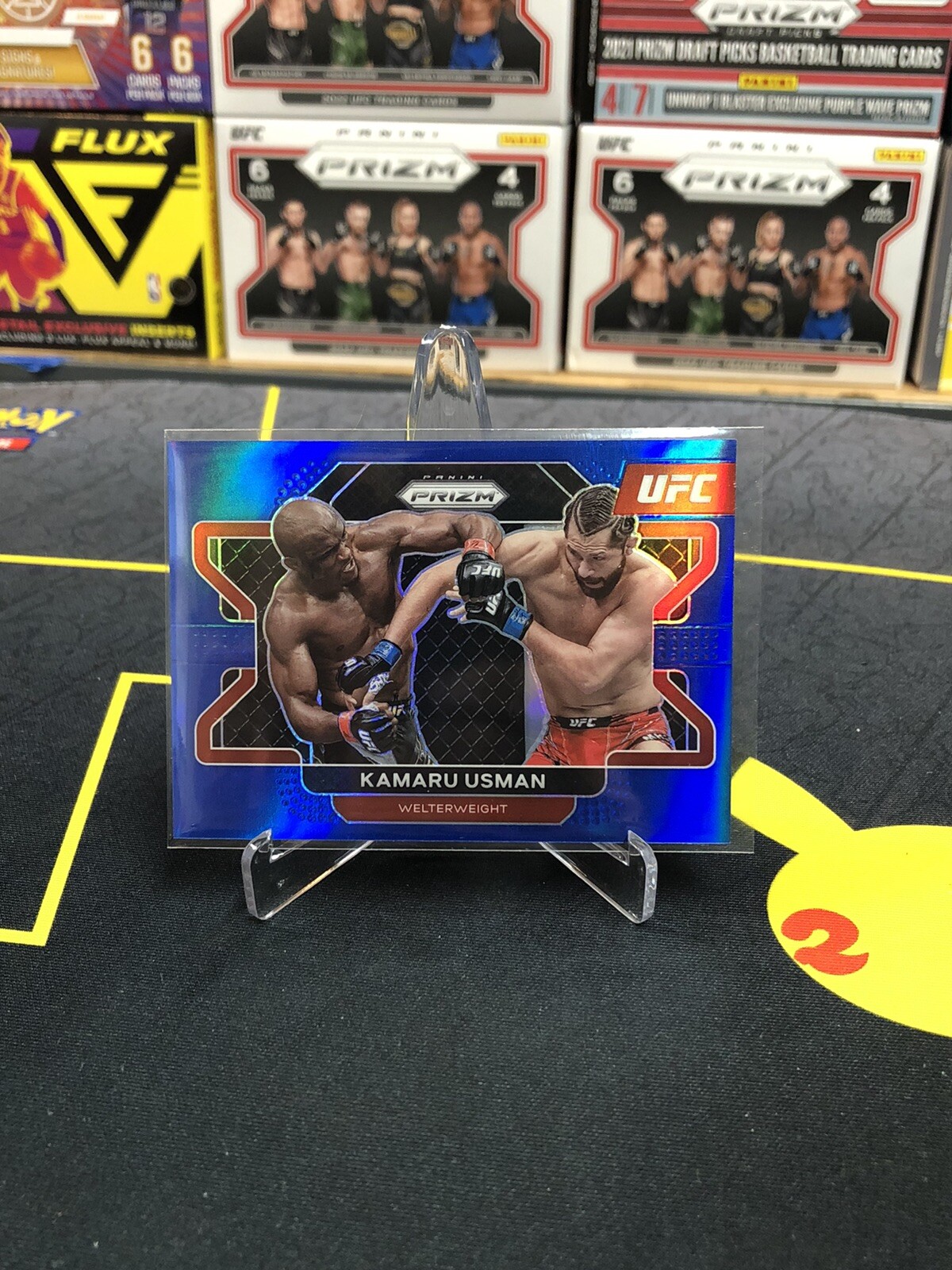 Kamaru Usman 2022 Panini UFC Prizm Blue Prizm 98 /199 #54 Champion