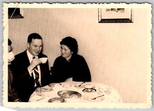 Vtg B&W Snapshot Smiling Man Suit Drinking Tea Woman Dinner Table 1950s