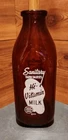 VINTAGE SANITARY FARM DAIRIES 1 QUART BROWN GLASS MILK BOTTLE WITH WHITE TEXT