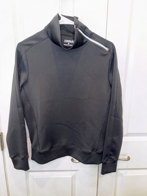 This is an AceGolfs black pullover with an asymmetrical zipper,