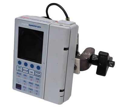 Sigma Spectrum Infusion Pump Device with Pole Clamp and Power Supply Adapter