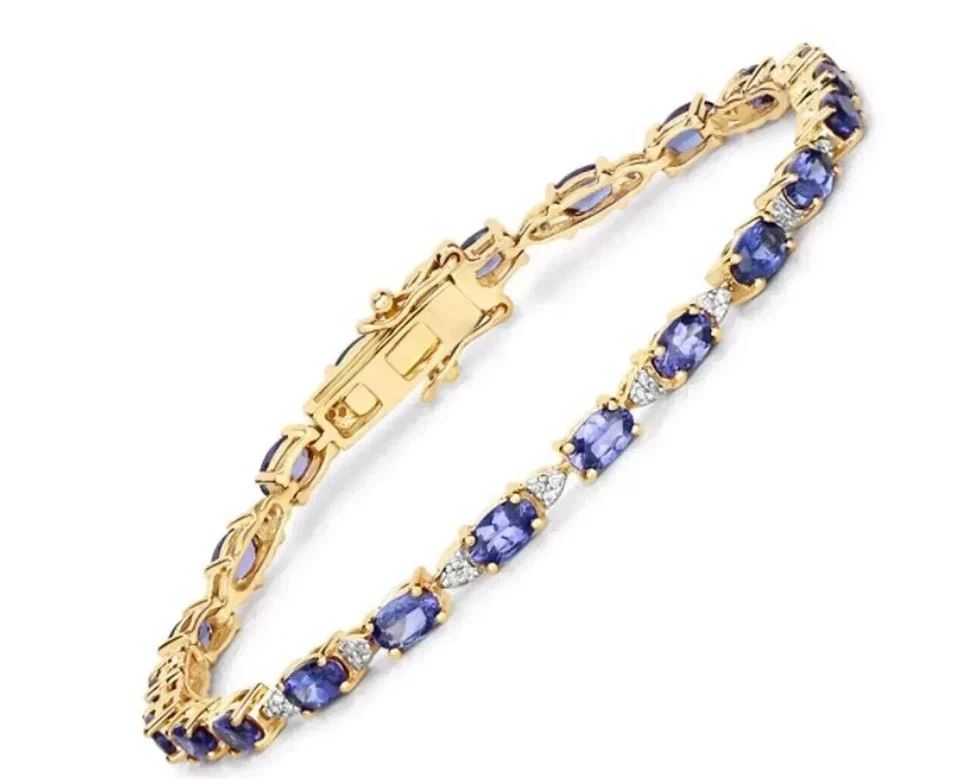 Brazalete de tenis de tanzanita azul de corte ovalado de 7 quilates enchapado en oro amarillo de 14 quilates Foto 2 de 4