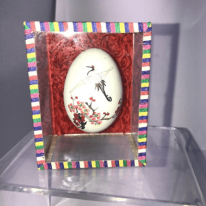 real egg from the people’s republic of china  flower and crane in glass case 85