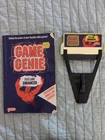 Nintendo NES Game Genie 1990 Game with Code Book