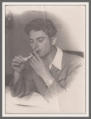 Handsome young man elegant boy smoking sigarette Interesting face Russian photo