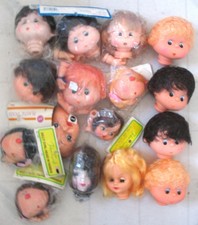 16 assorted plastic DOLL HEADS AND A FEW HANDS. see pictures.