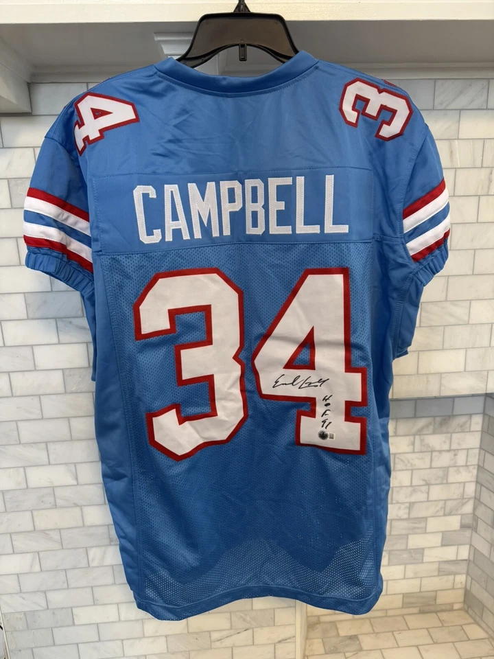 CAMISETA FIRMADA POR EARL CAMPBELL INSCRITA "HOF 91" Foto 2 de 4