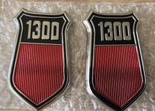 BRAND NEW CORTINA MK3 1300 PAIR OF OE SPEC WING BADGES COMPLETE WITH FITMENT PIN