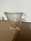 pink depression glass creamer in the "Royal Lace" pattern, by the Hazel-Atlas