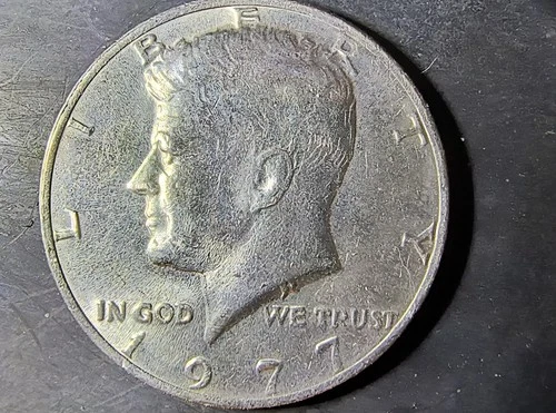 1977 Kennedy Half Dollar With No Mint Mark And No FG Initials VF/ AU.