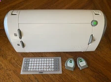 Cricut CRV001 Personal Electronic Cutter W/ (2) Cricut Cartridges.