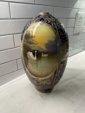 antique hand painted Nippon Cobalt Blue vase featuring swans Heavy Gold Trim