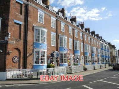 PHOTO  WEYMOUTH  THE DEVONSHIRE BUILDINGS ON THE ESPLANADE ARE DECKED OUT IN TRA