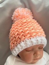 Brand New hand made crochet baby hat , Peach and White pom pom Early Baby