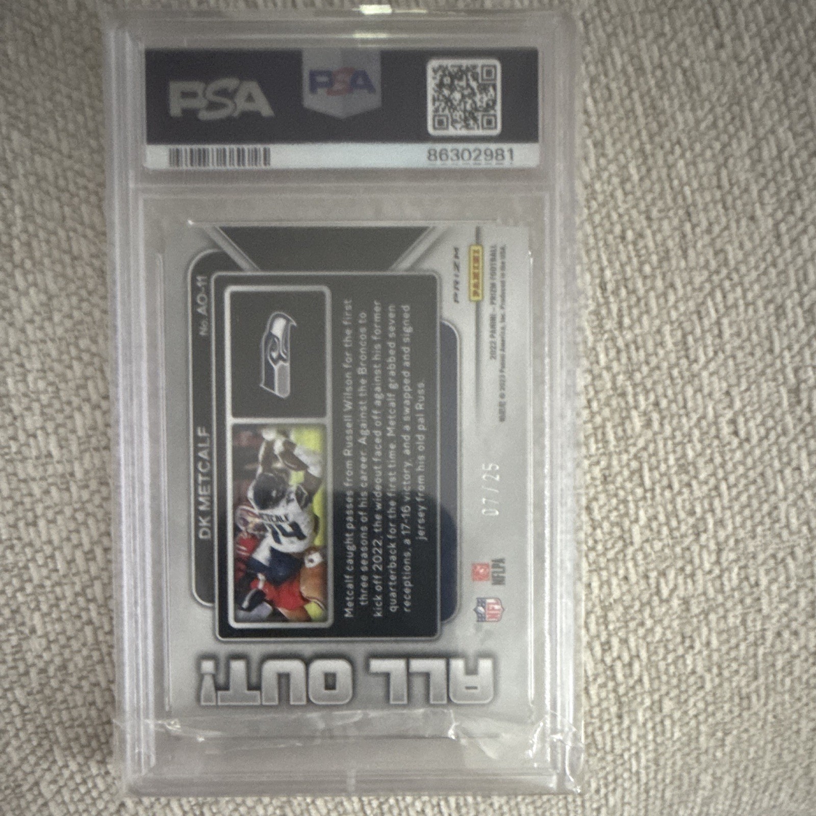 Panini 2022 Prizm All Out! DK Metcalf AO-11 Mojo Prizm 7/25 PSA 10 pop 3 view 2