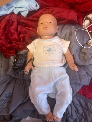 Reality works baby 2,  white male, charger included, untested, no flash drive 