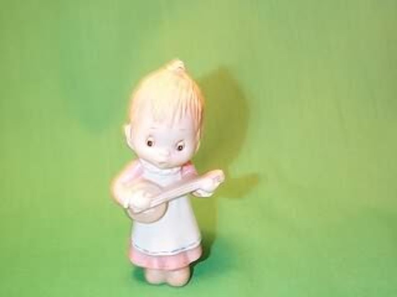 'Angel holding ' 'Fine Porcelain' Series Betsey Clark Ornament