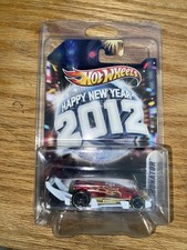 HOT WHEELS. HAPPY NEW YEAR 2012 RED CARBONATOR W/PROTECTOR