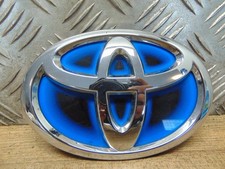 Toyota Yaris 3 MK3 Facelift Hybrid Emblem vorne Kühlergrill 75301-0D130