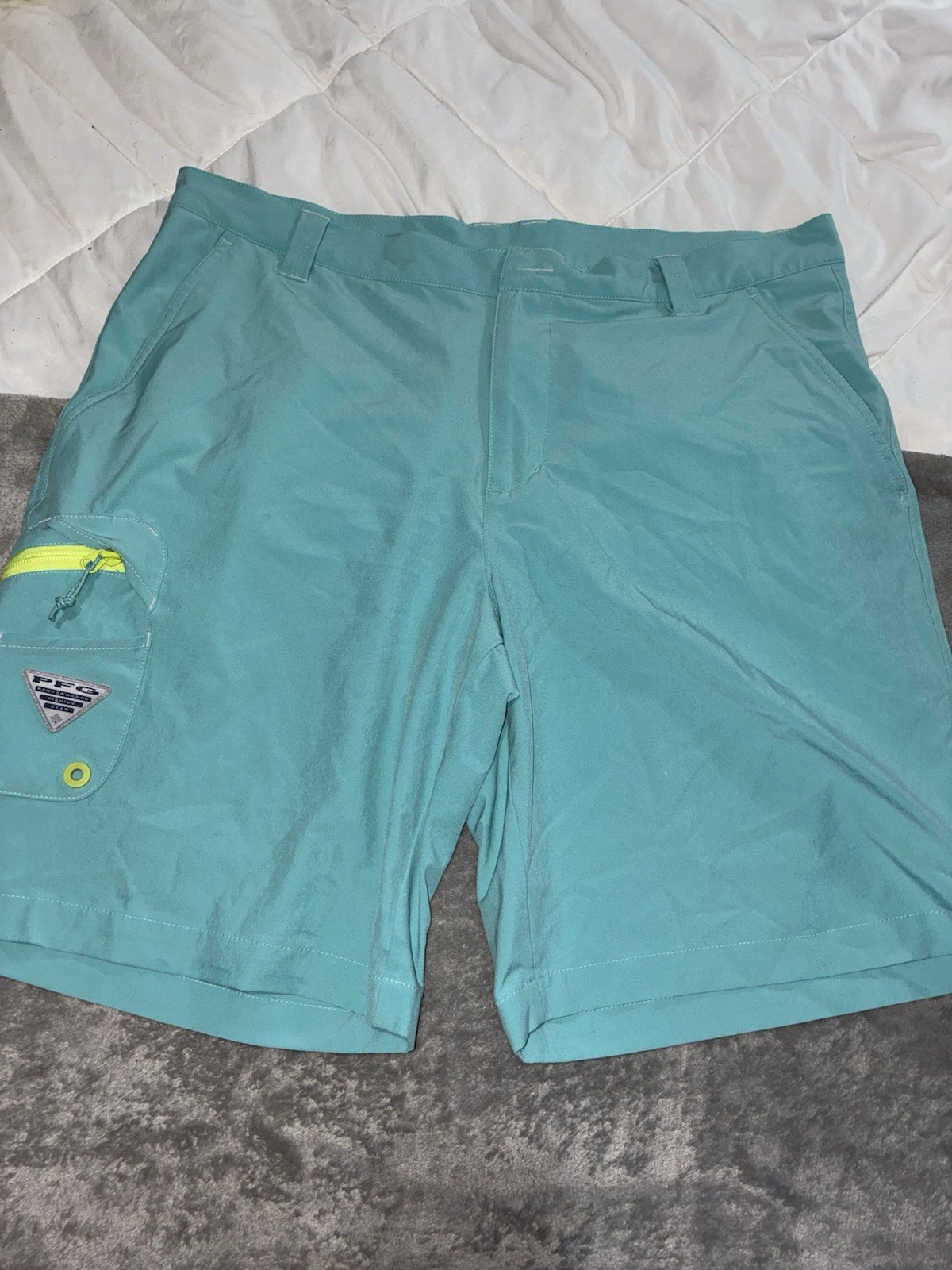 Columbia PFG Terminal Tackle short teal/vivid blue color neon yellow zipper.
