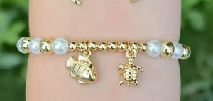 Authentic Beaded bracelets with marine charms and pearls with 18-karat gold-plated