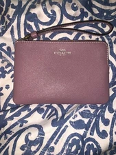 Coach coin purse purple with zip around and strap preowned and in mint condition