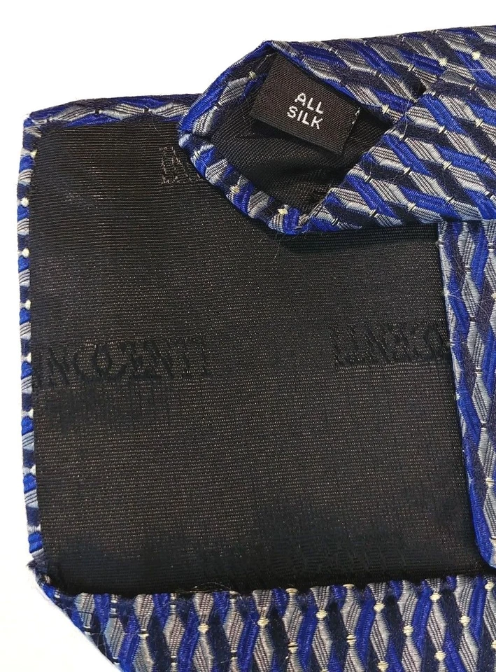 Corbata de seda italiana para hombre TOM JAMES, INOCENTI tejida geométrica negra azul, dorada Foto 4 de 4