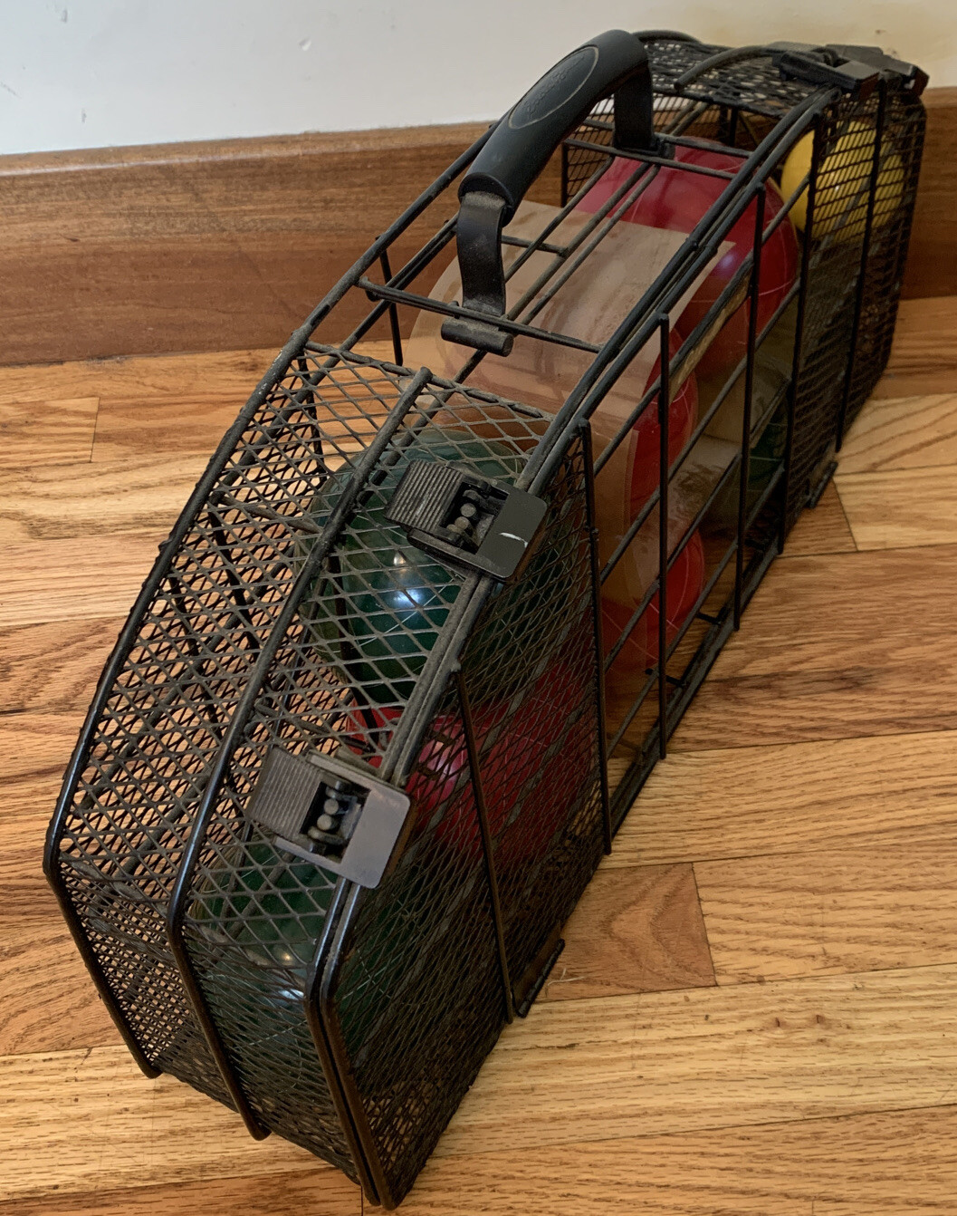 VINTAGE EDDIE BAUER COMPETION BOCCE BALL SET IN A STEEL WIRE CARRYING