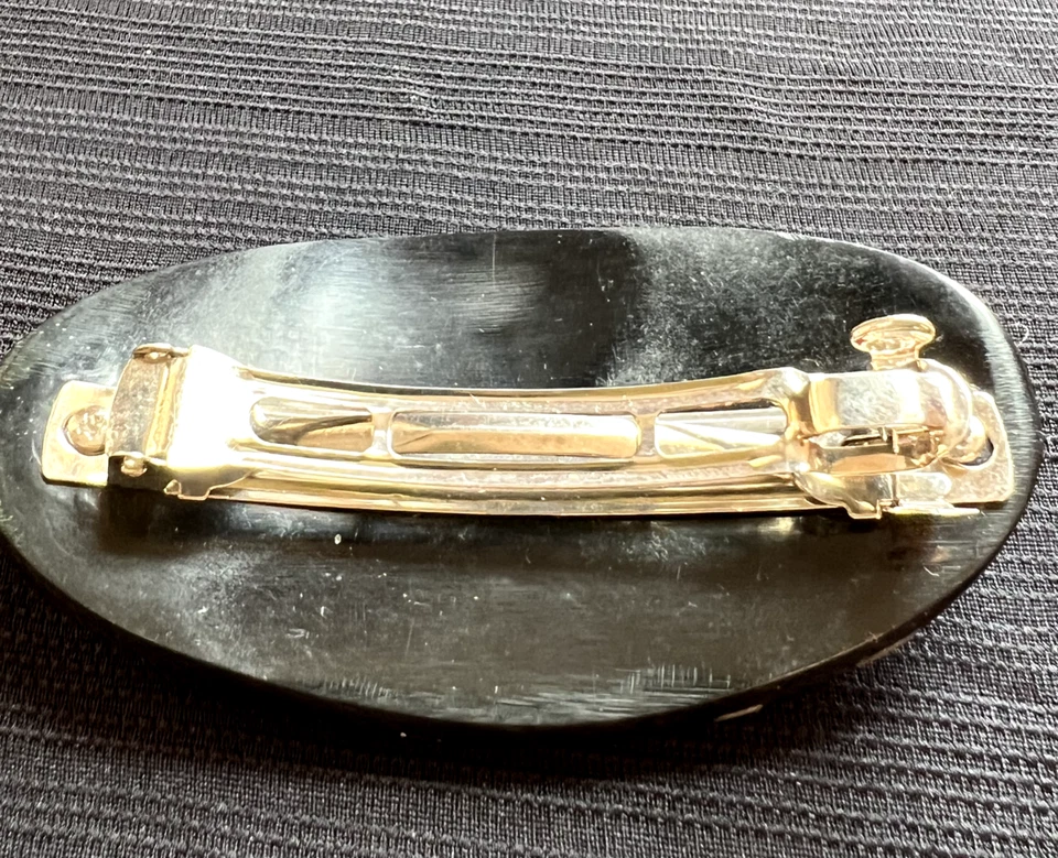 Pinza de pelo ovalada negra con incrustación de nácar Foto 2 de 2