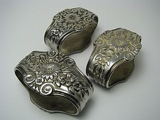 SET of 3 SILVERPLATE SILVER PLATED NAPKIN RINGS NAPKIN HOLDERS "Flowers" ca1900s