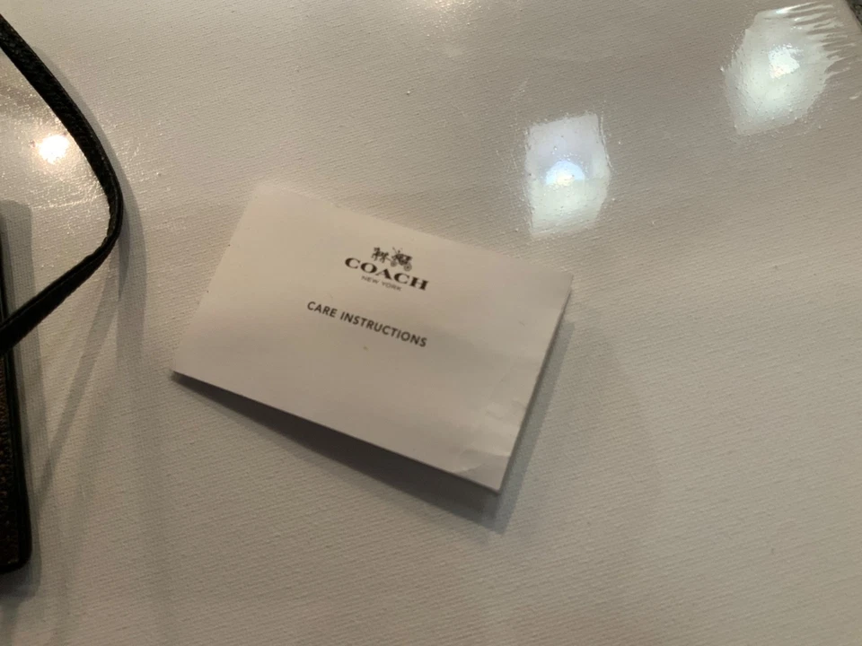 Estuche con cordón de cuero negro marrón Coach Signature usado en excelente estado Foto 4 de 4