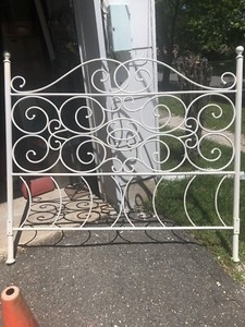 White wrought iron head board.