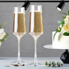 A pair of 8.5oz glass champagne long leg water glasses