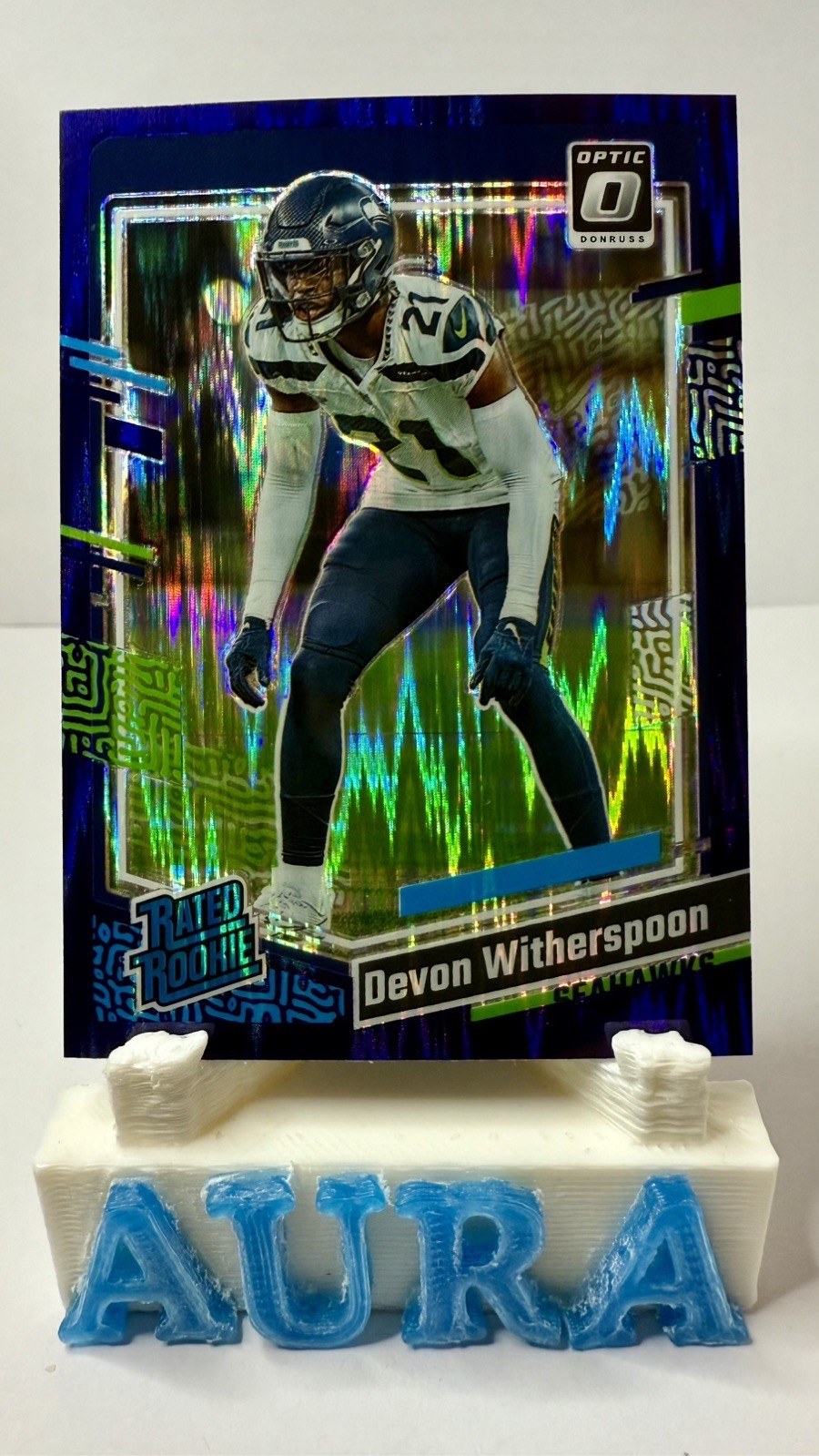 2023 Donruss Optic #292 Devon Witherspoon Purple Shock Rated Rookie