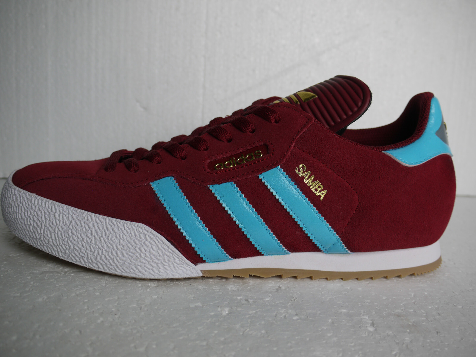 claret and blue adidas samba