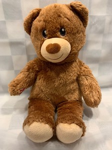 teddy bear with stitched eyes