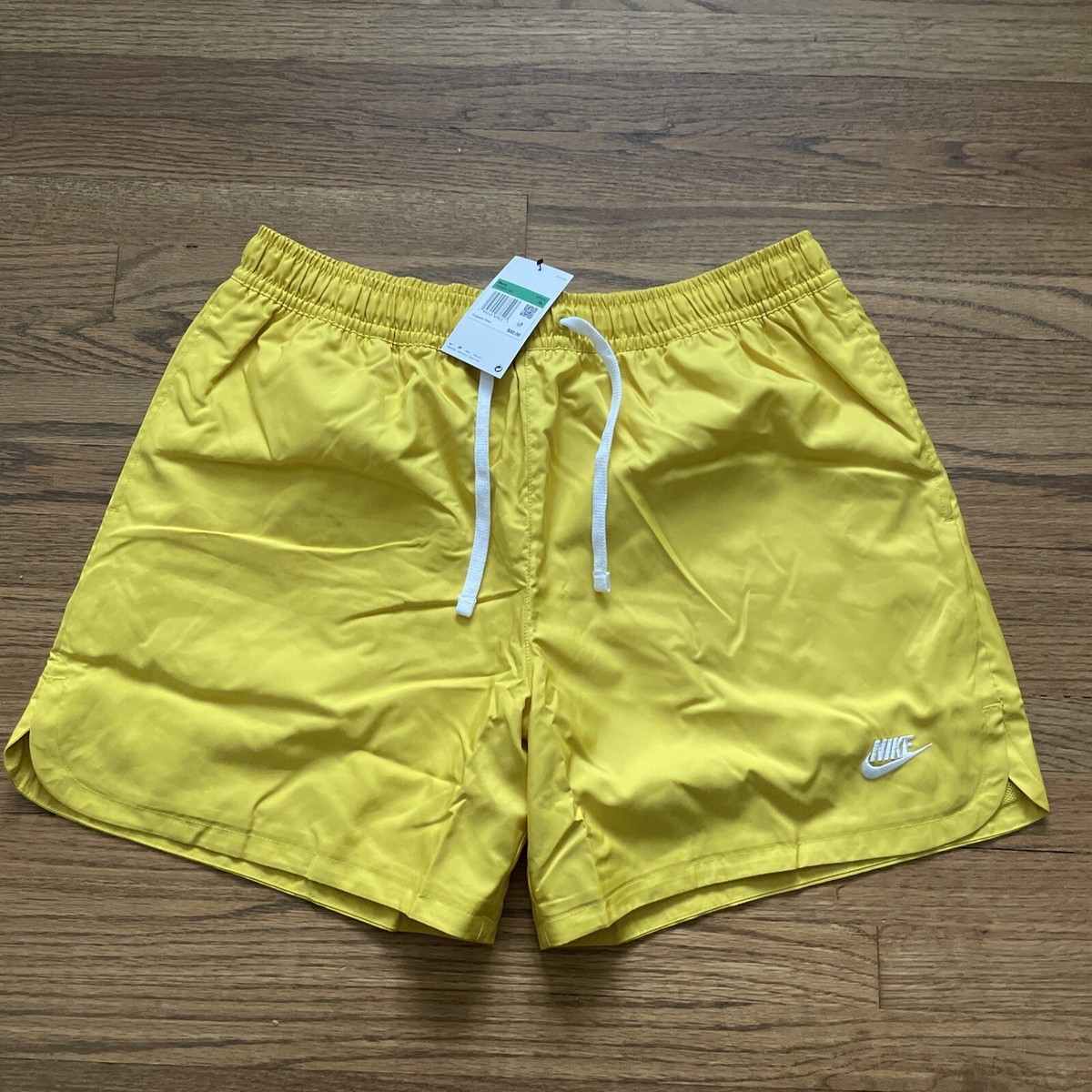 yellow woven nike shorts